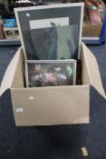 A large box of pictures and prints