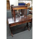 A reproduction mahogany Sutherland table and nest of tables