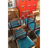 A set of four inlaid mahogany dining chairs