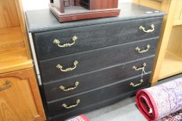 An antique style four drawer chest