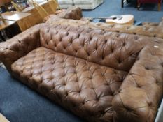 A brown studded leather Chesterfield style settee CONDITION REPORT: This is a pair