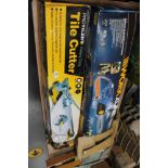 A tile cutter together with a boxed electric chainsaw