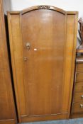 An early twentieth century oak single door cabinet