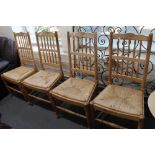 Four country style rail backed kitchen chairs