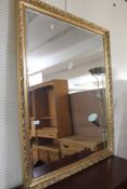 A gilt framed bevelled mirror