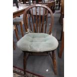 An antique elm kitchen chair