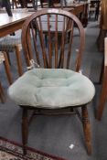 An antique elm kitchen chair