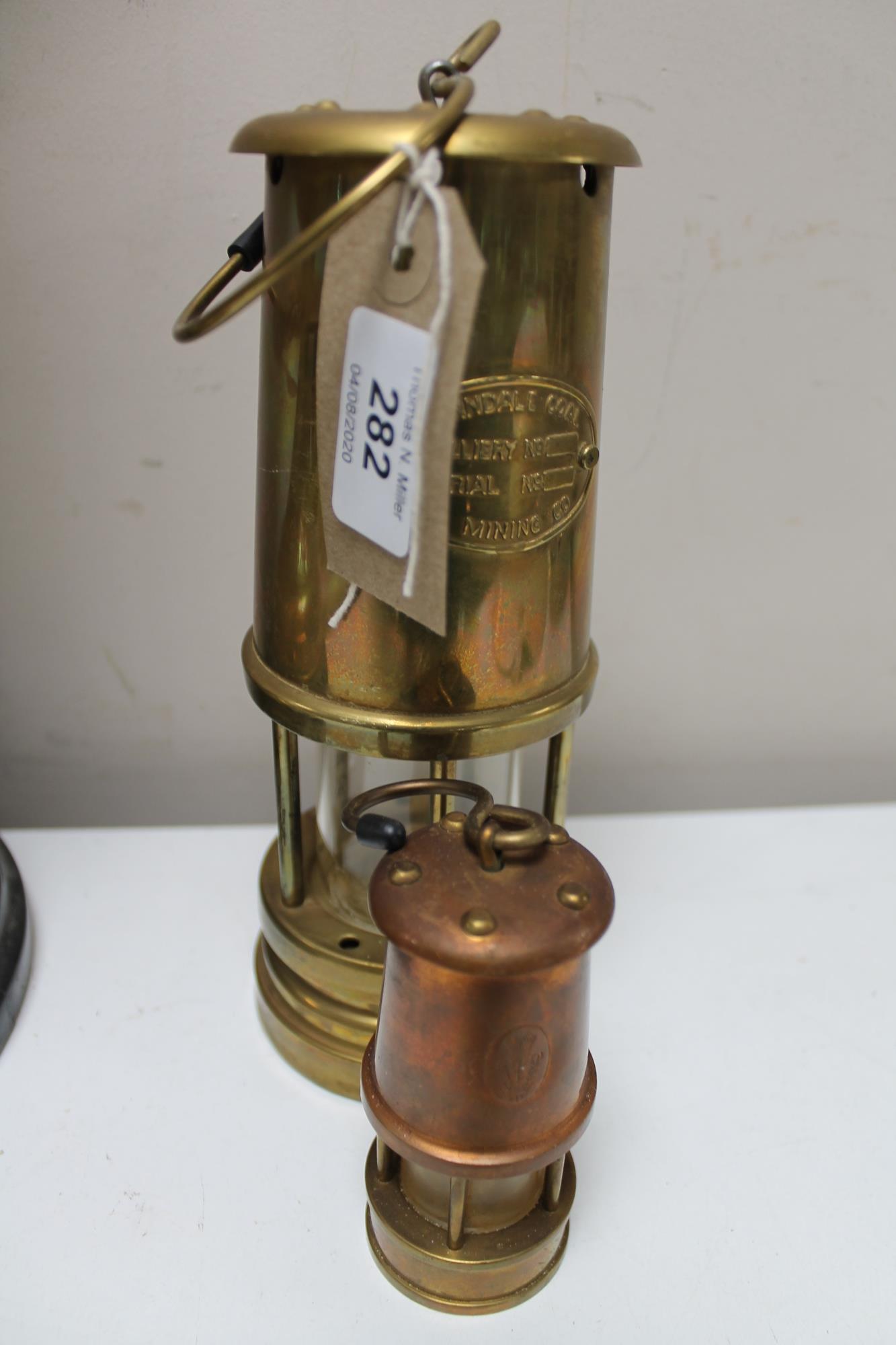 A Ferndale miner's lamp together with a miniature miner's lamp