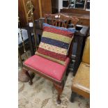 A nineteenth century oak chair together with a cushion