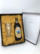 A bottle of Newcastle Brown Ale with glass in presentation box,