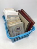 A basket of a large quantity of cigarette cards in albums,