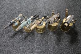 A collection of five antique brass blow lamps