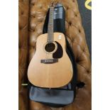 A Canadian acoustic guitar in gig bag