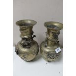 A pair of Chinese brass embossed vases