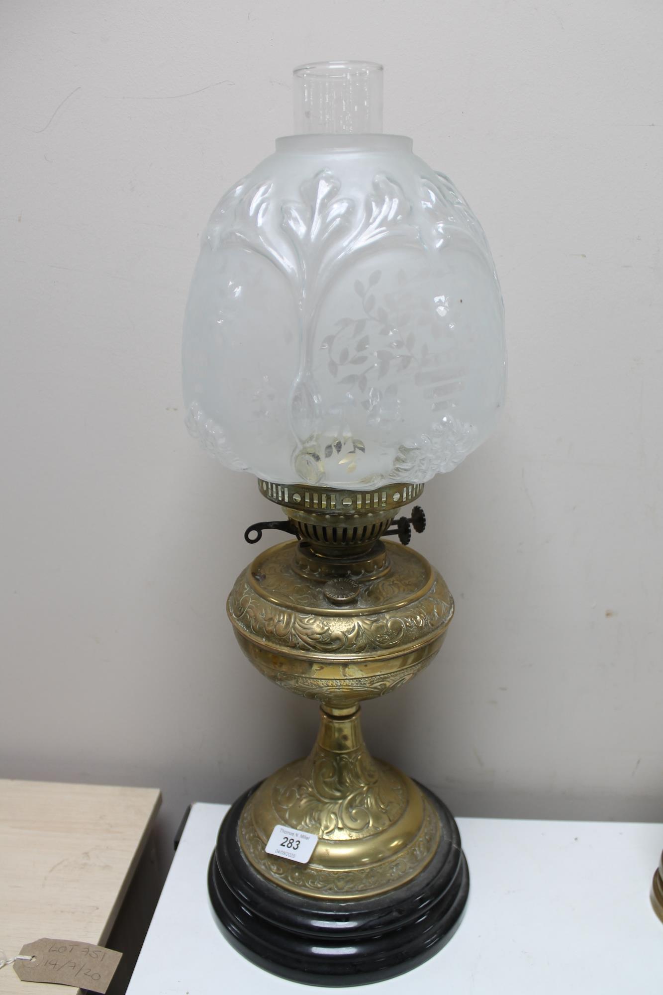 A Victorian brass and glass oil lamp