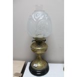 A Victorian brass and glass oil lamp