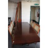 A reproduction mahogany extending dining table and six chairs