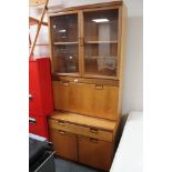 A teak cocktail cabinet