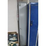 A metal storage cabinet with key