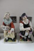 A pair of antique Staffordshire glazed pottery figures a/f