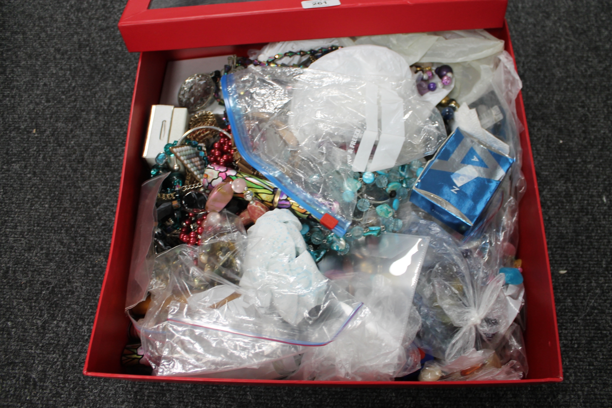 A large box of costume jewellery