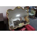 A gilt framed ornate mirror