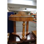 A Victorian side table with lift up top
