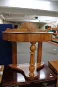 A Victorian side table with lift up top