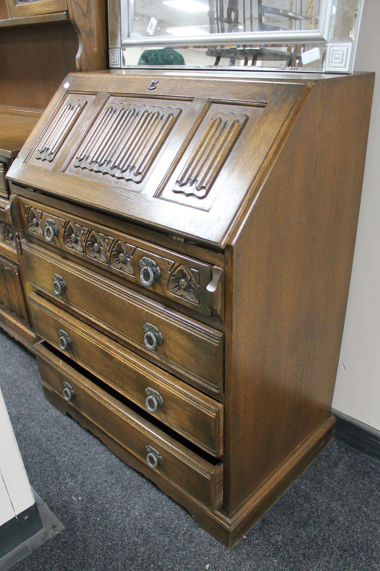 A carved oak bureau