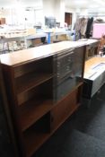 A mid century sliding glazed teak bookcase