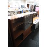 A mid century sliding glazed teak bookcase