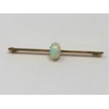 A yellow gold opal bar brooch