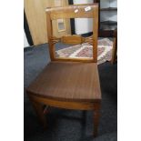A set of five oak dining chairs