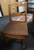 A set of five oak dining chairs