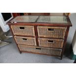 A glass topped wicker five drawer chest CONDITION REPORT: 95cm wide by 33cm deep by