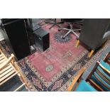 An antique fringed eastern carpet