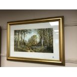 A gilt framed highlighted print - English country landscape