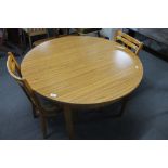 A formica topped kitchen table and two chairs