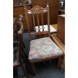 An Edwardian oak dining chair