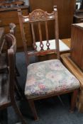 An Edwardian oak dining chair