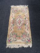 A small fringed Chinese rug