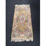 A small fringed Chinese rug