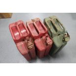 Three metal jerry cans