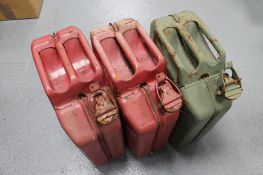 Three metal jerry cans