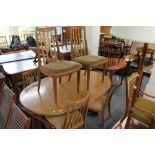 A teak extending dining table and six chairs