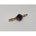 A gold amethyst brooch