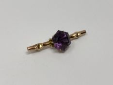 A gold amethyst brooch