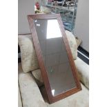 A contemporary hardwood mirror