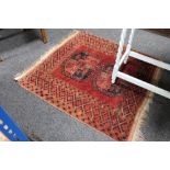 A fringed eastern rug