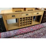 A contemporary light oak kitchen sideboard with bottle rack CONDITION REPORT: 180cm